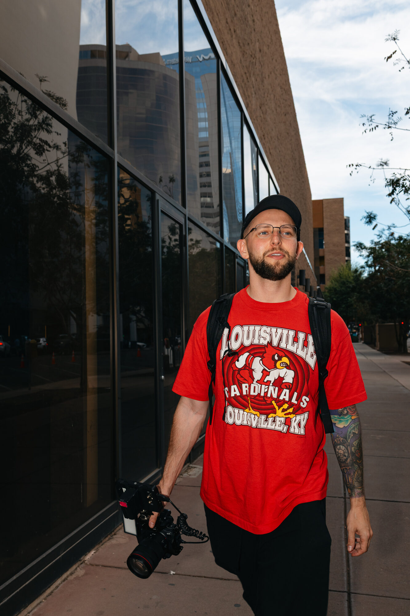 Dom Tomasello portrait on a Las Vegas street, camera in hand